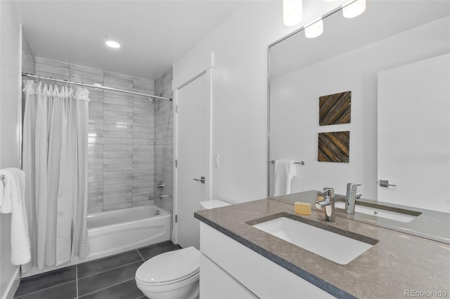 full bathroom with shower / tub combo, vanity, tile patterned floors, and toilet