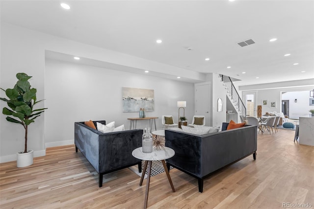 living room with light hardwood / wood-style floors