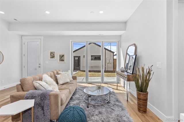 living room with light hardwood / wood-style flooring