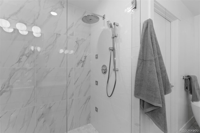 bathroom with tiled shower