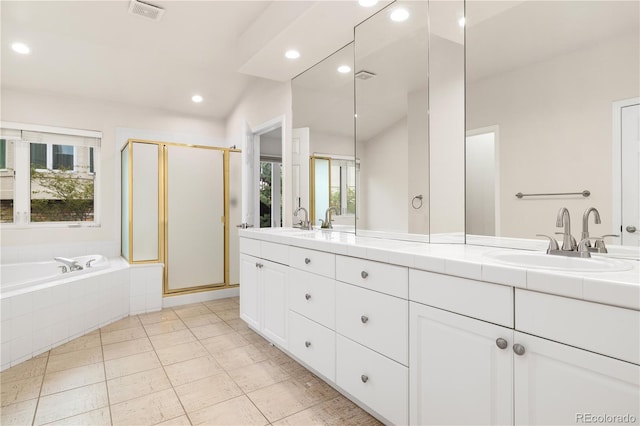 14032 E Chenango Dr, Aurora, CO 80015 - full bath featuring double vanity, a stall shower, a garden tub, recessed lighting, and tile patterned floors