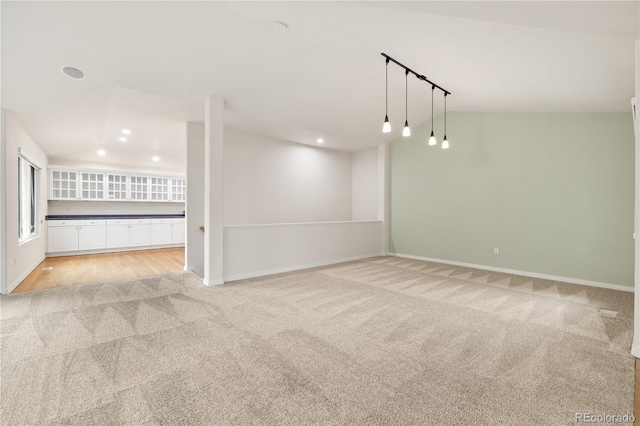 14032 E Chenango Dr, Aurora, CO 80015 - empty room featuring light carpet, baseboards, and recessed lighting