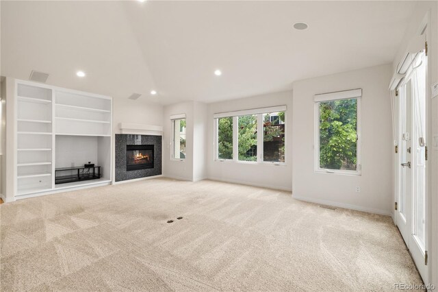 14032 E Chenango Dr, Aurora, CO 80015 - unfurnished living room featuring light colored carpet, recessed lighting, a fireplace, and baseboards