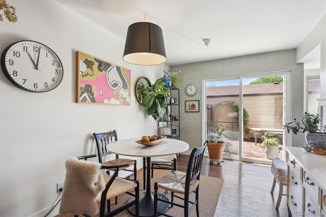 dining area featuring wood-type flooring