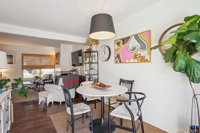 dining area with dark wood finished floors
