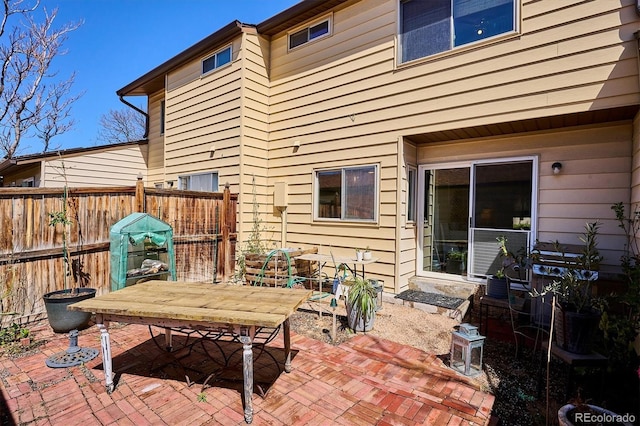 view of patio / terrace featuring outdoor dining area and fence