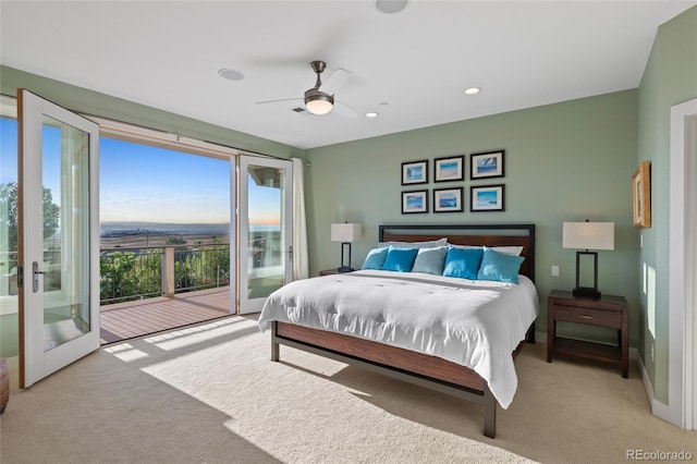 bedroom featuring ceiling fan, light colored carpet, access to outside, and multiple windows