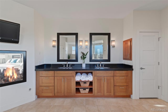 bathroom with tile patterned floors and vanity