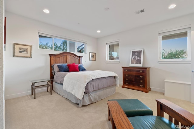 bedroom featuring light colored carpet