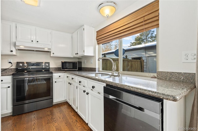 kitchen with white cabinetry, appliances with stainless steel finishes, sink, and dark wood-type flooring