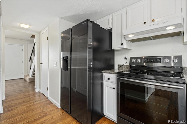 kitchen with fridge with ice dispenser, white cabinetry, stainless steel range with electric cooktop, and light wood-type flooring