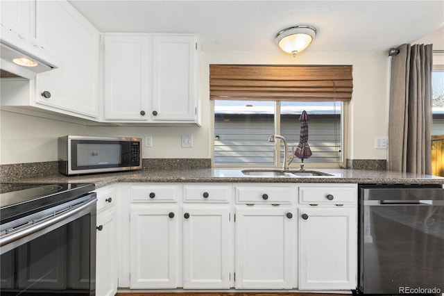 kitchen with sink, stainless steel appliances, and white cabinets