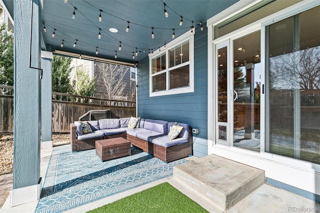 view of patio / terrace with an outdoor living space and fence