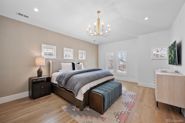 bedroom featuring a chandelier, light wood-style flooring, baseboards, and recessed lighting