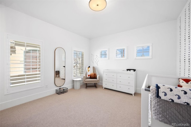 bedroom featuring carpet floors and baseboards