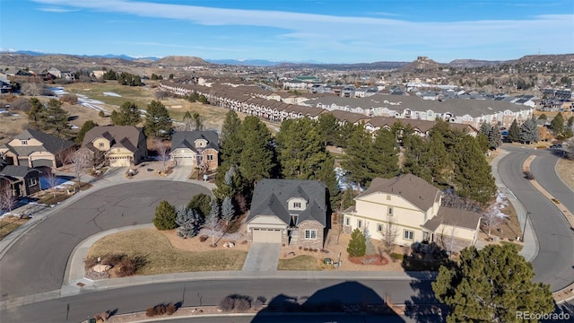 birds eye view of property with a mountain view