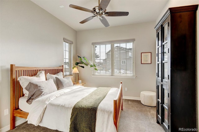 bedroom featuring ceiling fan and light colored carpet