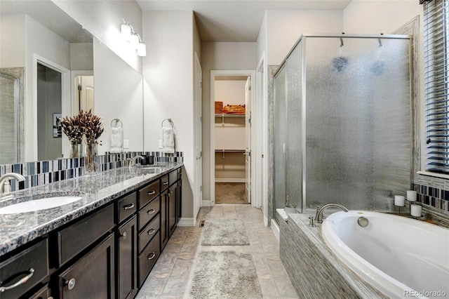 bathroom with plus walk in shower and vanity