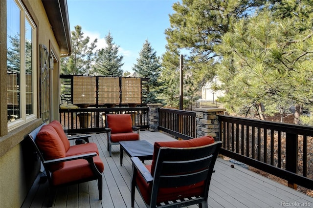 wooden deck featuring outdoor lounge area