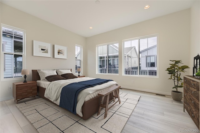 bedroom with light hardwood / wood-style floors