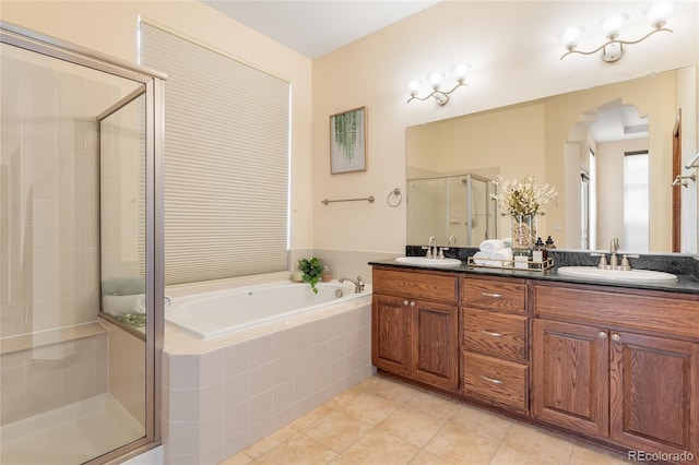 5723 S Union Ct, Littleton, CO 80127 - bathroom featuring a shower stall, a bath, double vanity, and tile patterned flooring