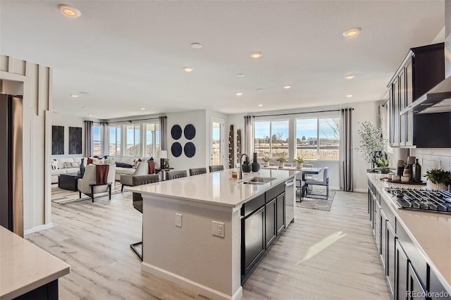 14147 Bunny Hop Ln, Parker, CO 80134 - kitchen with a sink, stainless steel appliances, plenty of natural light, light wood-style floors, and recessed lighting