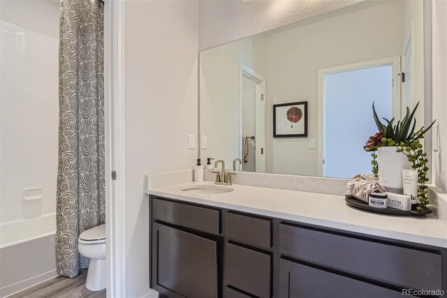 14147 Bunny Hop Ln, Parker, CO 80134 - full bathroom featuring toilet, wood finished floors, vanity, and shower / bath combination with curtain