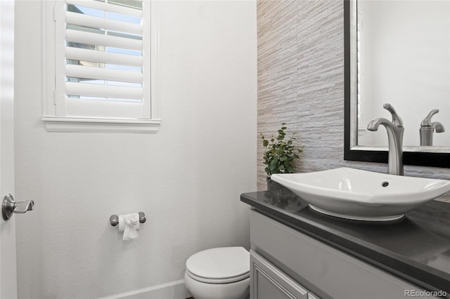 half bath with vanity and toilet