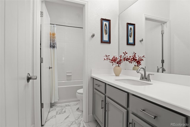 full bath featuring vanity, marble finish floor, shower / bathtub combination with curtain, and toilet