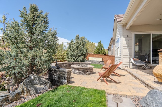 view of patio / terrace with an outdoor fire pit