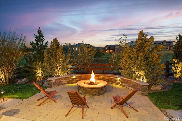patio terrace at dusk with a fire pit