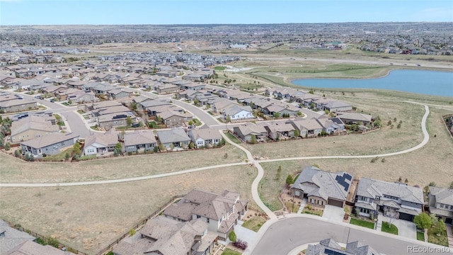 bird's eye view with a residential view and a water view