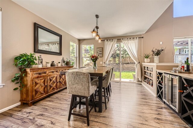 10694 Cedarcrest Cir, Highlands Ranch, CO 80130 - dining room featuring wood finished floors, baseboards, and beverage cooler