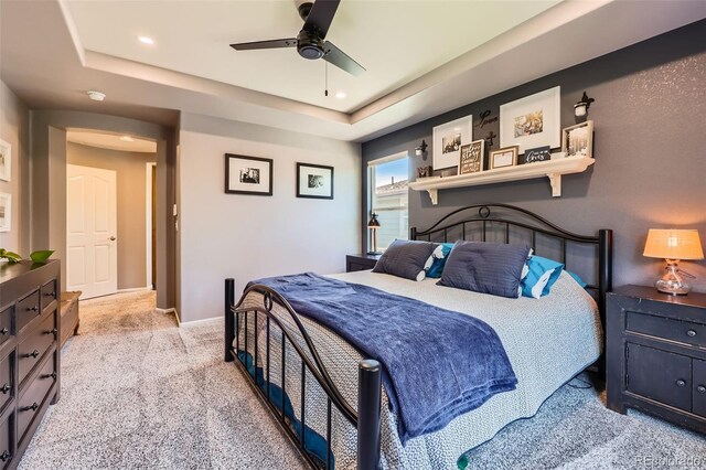 10694 Cedarcrest Cir, Highlands Ranch, CO 80130 - carpeted bedroom with a tray ceiling, baseboards, a ceiling fan, and recessed lighting