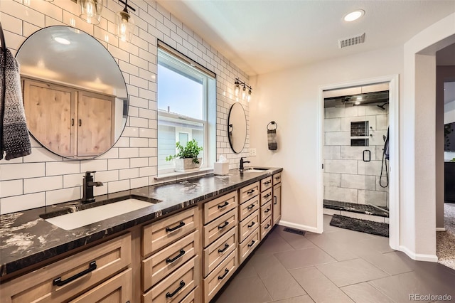 10694 Cedarcrest Cir, Highlands Ranch, CO 80130 - bathroom with baseboards, double vanity, a stall shower, backsplash, and tile patterned flooring
