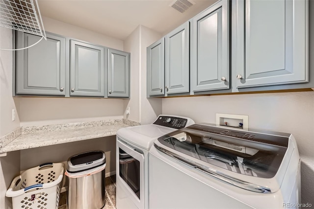 10694 Cedarcrest Cir, Highlands Ranch, CO 80130 - laundry room featuring cabinet space and independent washer and dryer