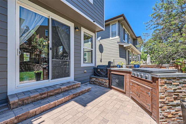 10694 Cedarcrest Cir, Highlands Ranch, CO 80130 - view of patio / terrace with exterior kitchen