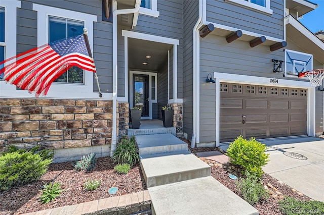 10694 Cedarcrest Cir, Highlands Ranch, CO 80130 - doorway to property featuring a garage and concrete driveway