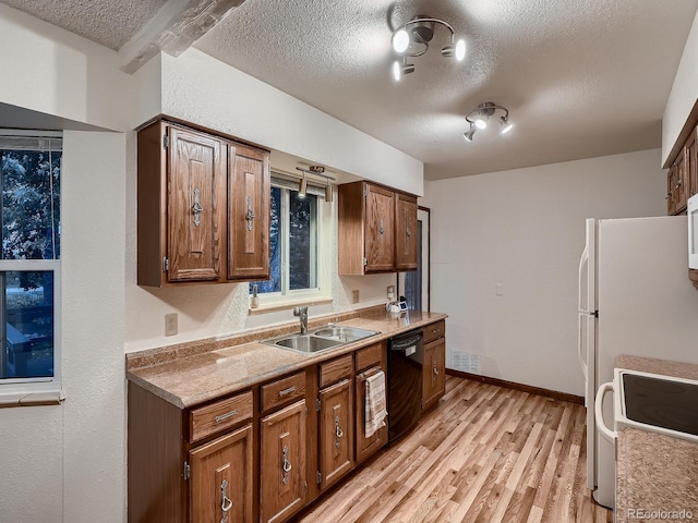 7112 S Platte Canyon Dr, Littleton, CO 80128 - kitchen featuring a sink, white range oven, black dishwasher, a textured ceiling, and light wood-type flooring