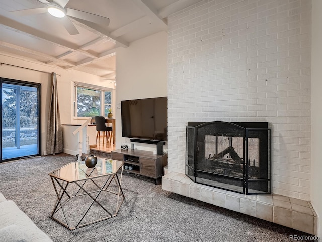 7112 S Platte Canyon Dr, Littleton, CO 80128 - carpeted living area featuring beam ceiling, a brick fireplace, a ceiling fan, coffered ceiling, and baseboards