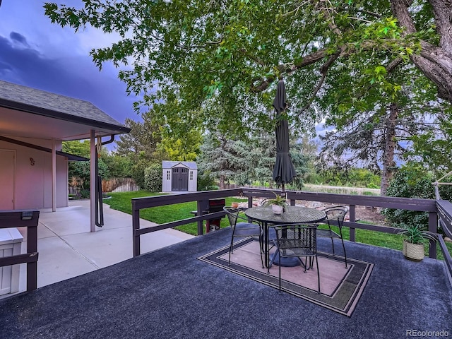 7112 S Platte Canyon Dr, Littleton, CO 80128 - wooden terrace with outdoor dining area and a patio