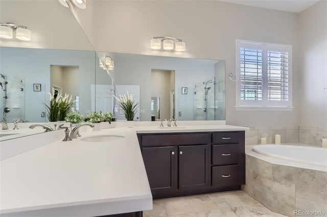 bathroom featuring vanity and separate shower and tub