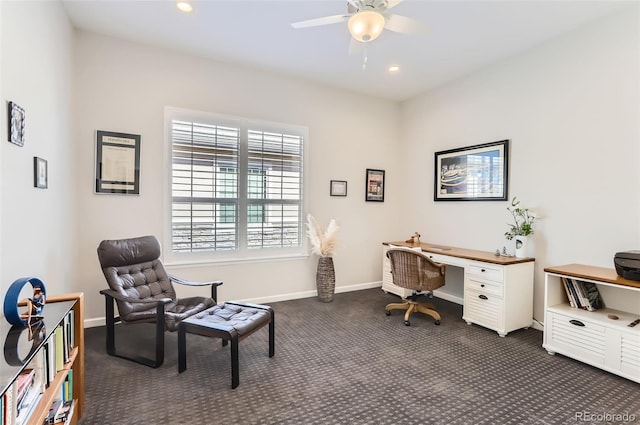 office area featuring ceiling fan and dark carpet