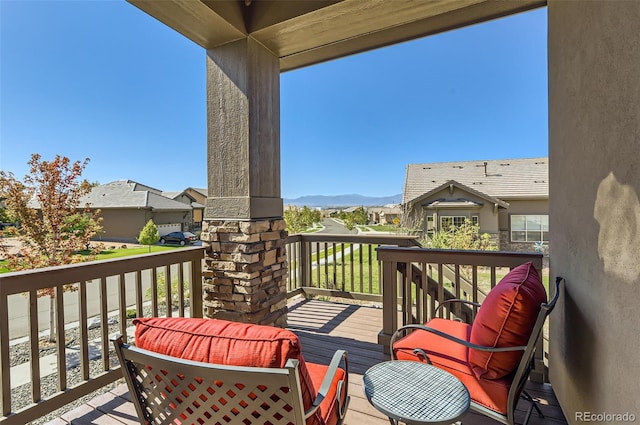 wooden deck featuring a mountain view