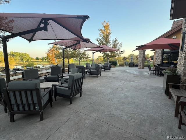 patio terrace at dusk with an outdoor living space