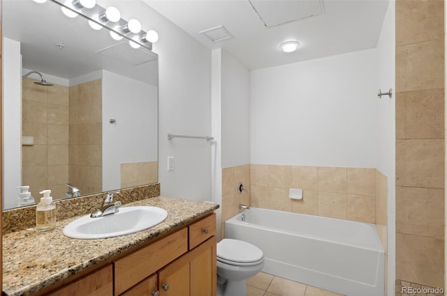 bathroom featuring visible vents, toilet, a garden tub, tile patterned floors, and vanity