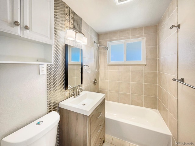 full bathroom with tile patterned floors, vanity, toilet, and tiled shower / bath