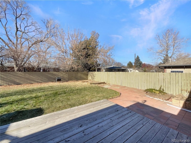 wooden terrace with a yard