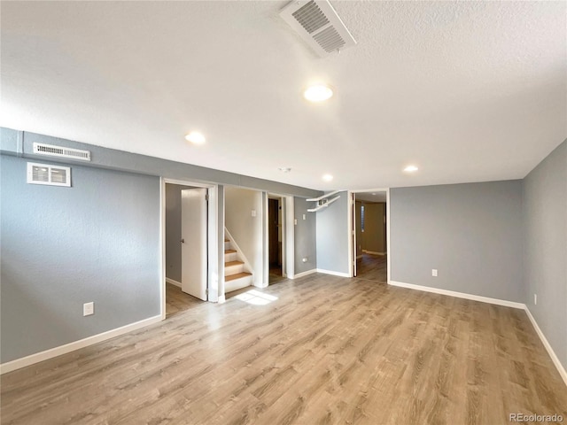 basement with wood-type flooring