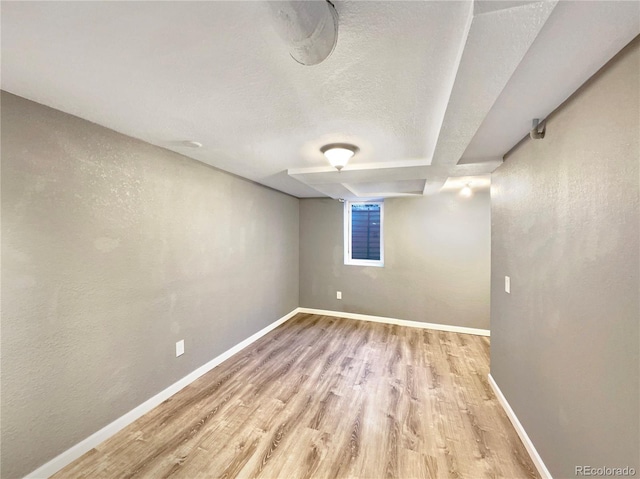 basement featuring light wood-type flooring